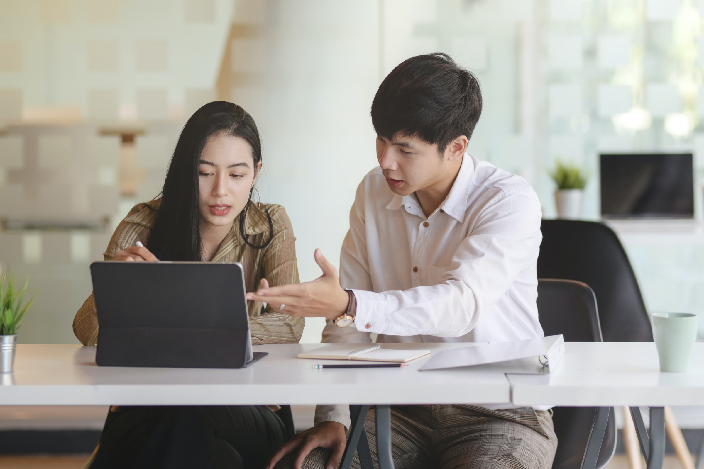 man providing business consultation services to woman